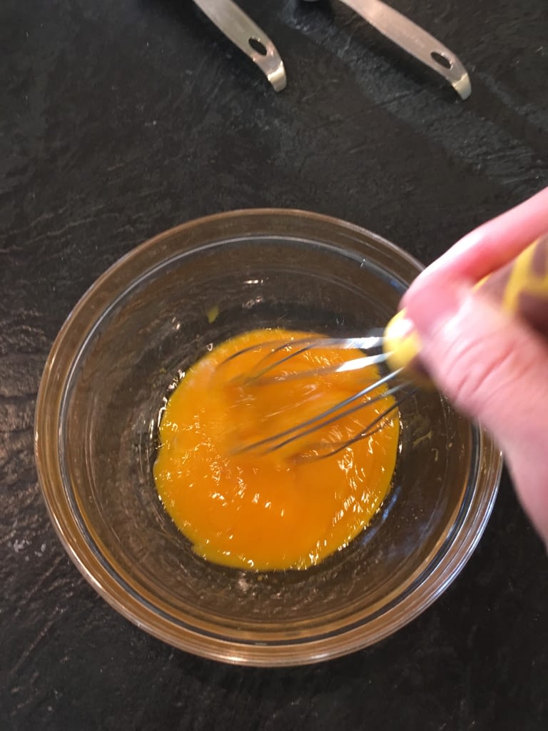 mixing egg yolks and oil